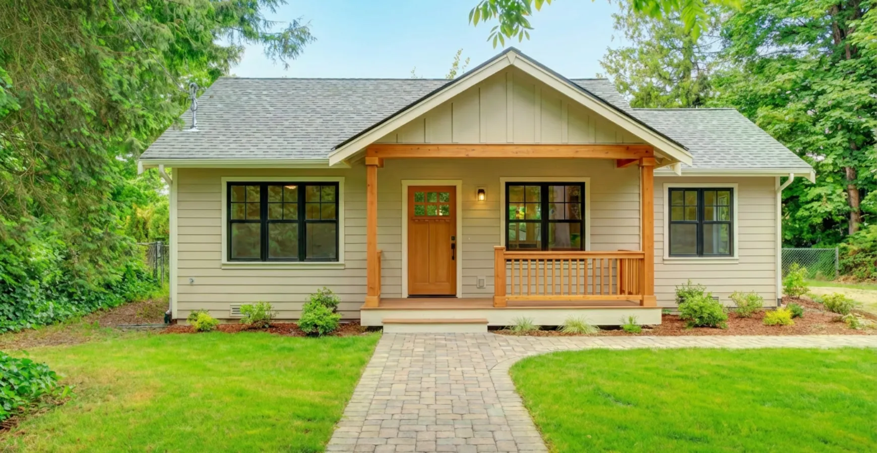Completed backyard guest house ADU in Los Angeles featuring modern exterior front porch walkway and landscaped yard