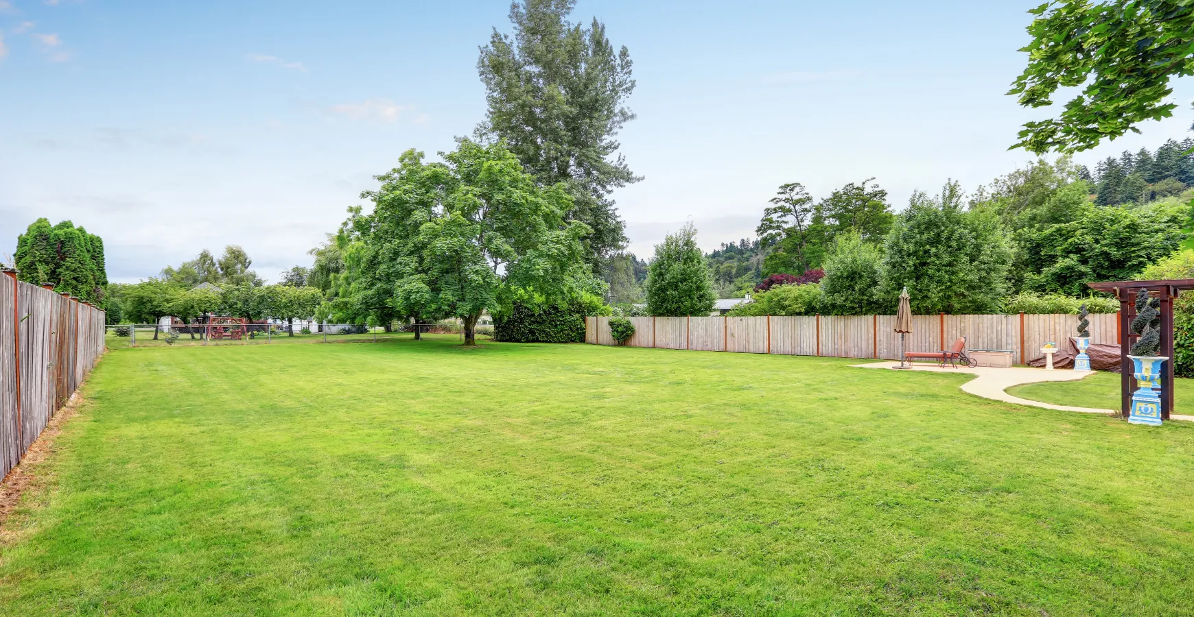 Empty backyard in Los Angeles before ADU construction with large open lawn space