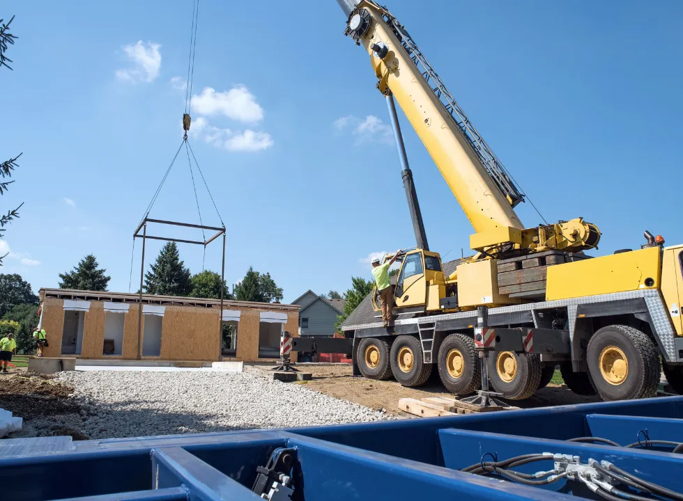 Prefab ADU installation in Los Angeles using crane to place modular unit onto foundation